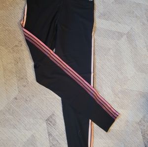 Pink leggings with pink stripes on sides